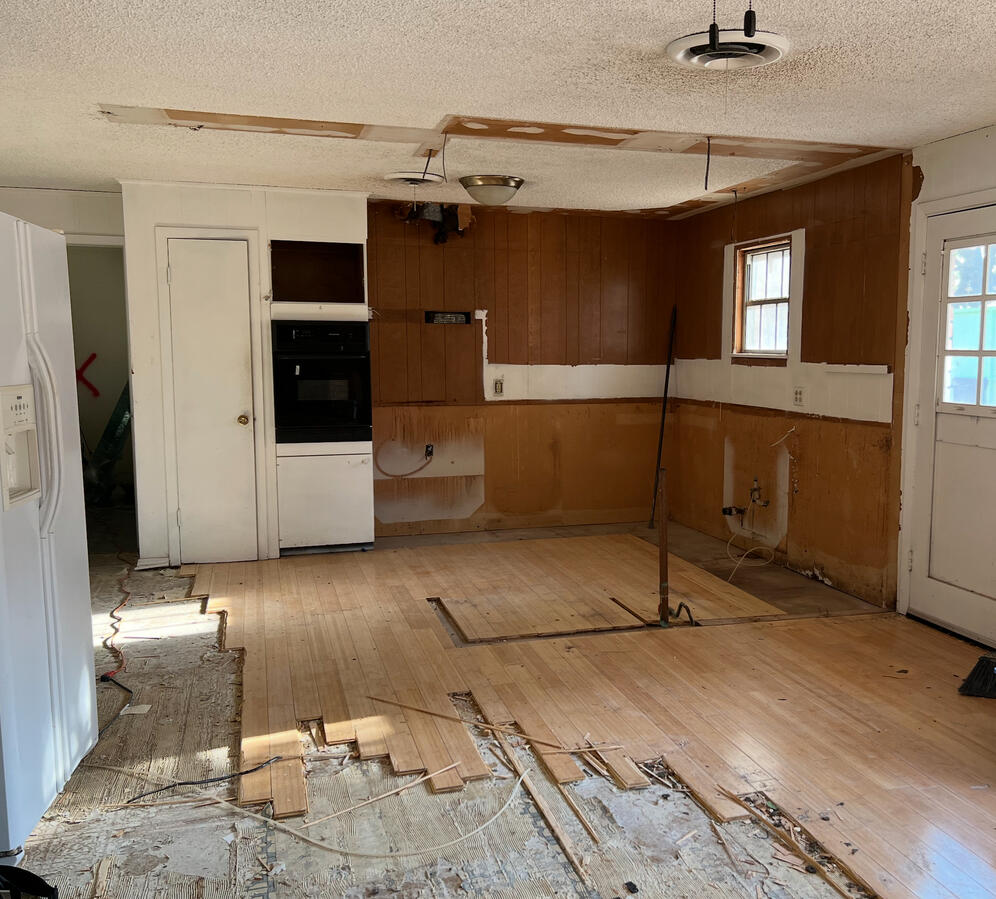 Kitchen and Living Room Demo Investment Property Kitchen and Living Room Demo, Kitchen and Wood Flooring Being Removed.