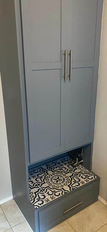 Shoe Storage Closet with Tiled Pet Faucet Area and Food Storage