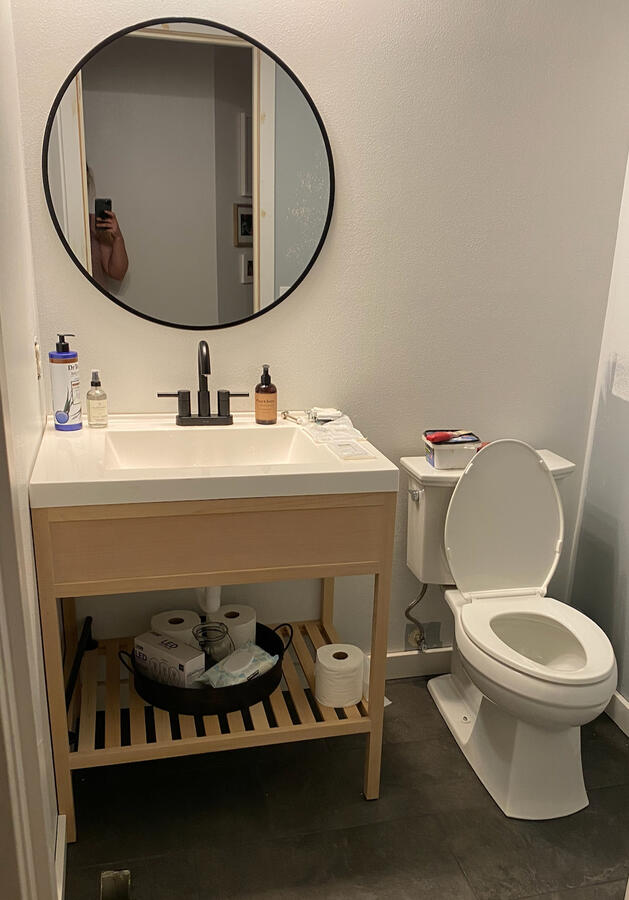 Half bath remodel progress with new tile flooring and small custom build oak vanity.