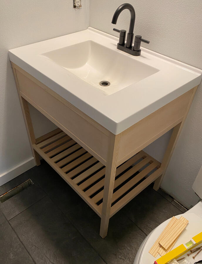 Newly Installed Single Sink Oak Vanity and New Tile Flooring